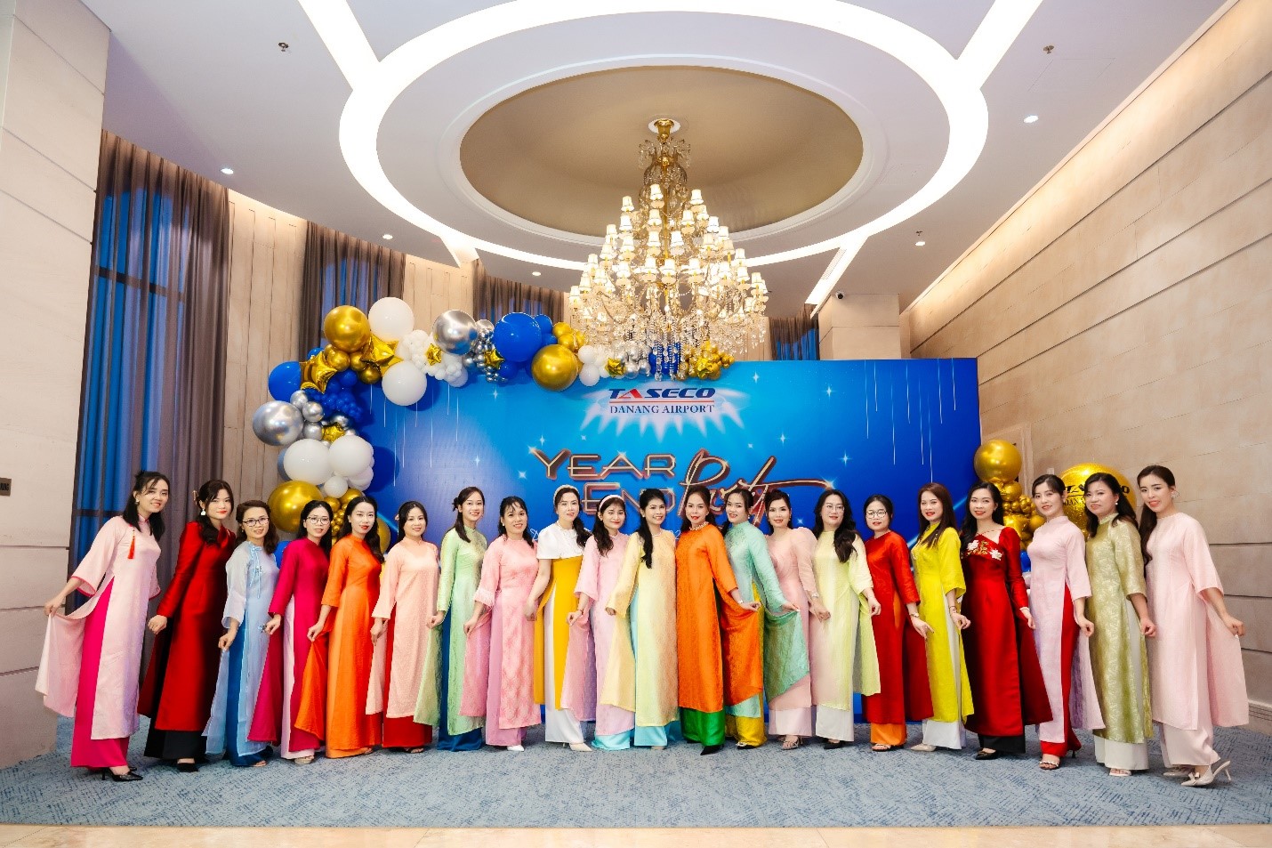 A group of women in colorful dressesDescription automatically generated